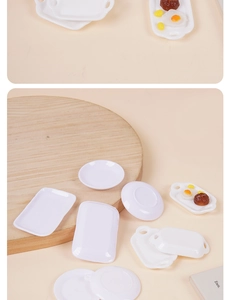 Miniature dollhouse kitchenware set with white plastic plates and tiny food models