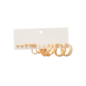 Gold heart stud and hoop earring set for women featuring minimalist metal designs