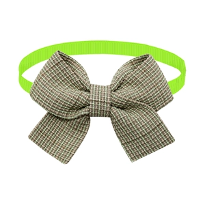 Detail of adjustable pet bow tie with taupe woven fabric and neon green elastic strap