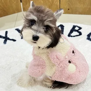 Pink and white plush dog vest with 3D animal design and built-in metal D-ring leash attachment
