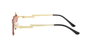 Detail of creative lightning bolt shaped metal temples and red lenses on hip hop sunglasses