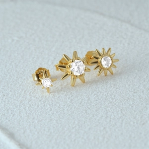 Detailed view of S925 silver star stud earrings with zirconia and gold plating
