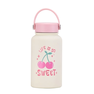 Detail of cream white vacuum insulated bottle with pink handle and cherry print