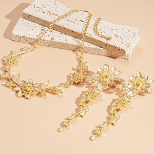 Golden flower and leaf jewelry set with sparkling rhinestones for wedding and gala events
