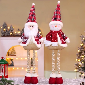 Detail of Santa and Snowman plush with red plaid hats and adjustable telescopic legs