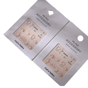 DIY nail art charms kit with assorted pearls and metal frames in gold and silver