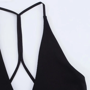 Detail of the black halter neckline and thin spaghetti straps on this stylish dress