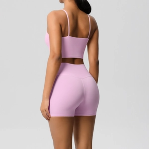 Pink yoga set with slim-fit camisole top and high-waist shorts for fitness training