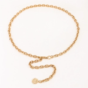 Detail of gold metal belt chain with sun pendant and lobster clasp for dresses
