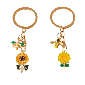 Pastoral bee and sunflower enamel keychains set with gold metal rings and green leaf charms