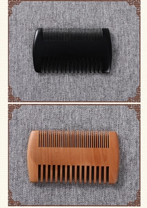 Close-up of double-sided wood and horn combs with fine and wide teeth for beard styling