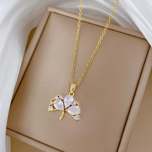 Elegant gold titanium steel clover necklace with sparkling clear pear-shaped gemstones