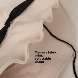 Detailed close-up of shapeable beige linen sun hat brim with flexible memory wire