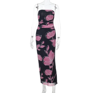 Detail of ruched black mesh maxi dress featuring vibrant pink floral print pattern