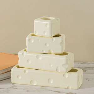 Macro detail of cheese-shaped silicone mold with realistic holes for DIY craft projects