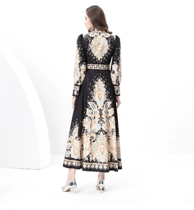 Detail of baroque mandala patterns on black long sleeve dress with back view model pose