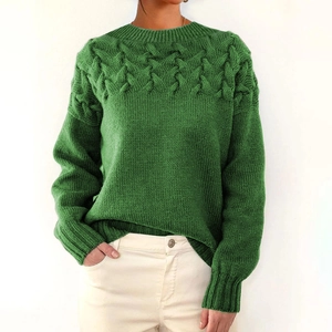 Close-up of cable knit texture and turtleneck detail on this grass green sweater