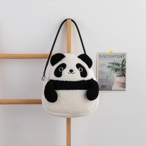 Detail of the soft plush panda shoulder bag with fluffy texture and black strap