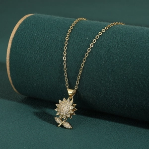 Gold rotating sunflower pendant necklace with zircon micro-paving on a velvet stand