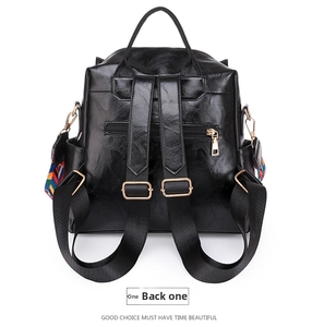 Rear view of black leather backpack with adjustable straps and anti-theft zipper pocket