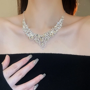 Close-up of sparkling waterdrop crystal necklace with elegant V-shaped silver metal pendant