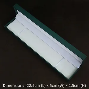 Detail of deep green long jewelry box with velvet lining measuring 22.5x5x2.5cm