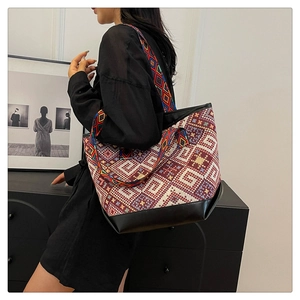 Ethnic style tote bag with geometric woven patterns and black PU leather base
