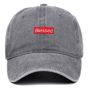 Detail of red rectangular Blessed embroidery on vintage grey washed cotton baseball cap