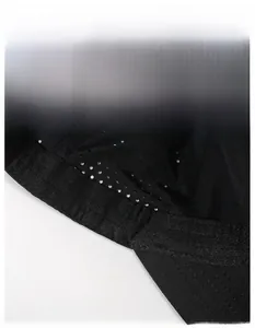 Detail view of the moisture-wicking sweatband and breathable mesh lining on the black cap