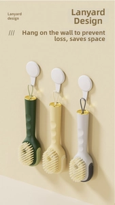 Lanyard design detail on cleaning brushes for space-saving storage on wall hooks