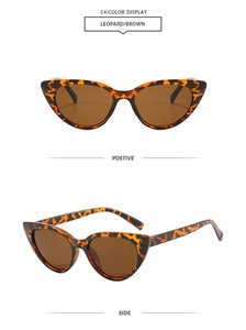 Detail view of vintage cat eye sunglasses featuring leopard print frames and brown lenses
