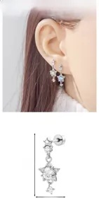 Detail view of star-shaped zircon ear stud with dimensions of 2.3cm height and 0.82cm width