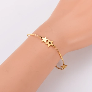 Gold star charm bracelet with frosted and polished double stars on a dainty tube chain