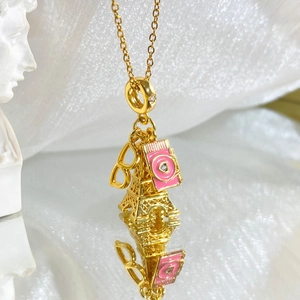 Titanium steel travel necklace with Eiffel Tower, pink camera and sunglasses charms