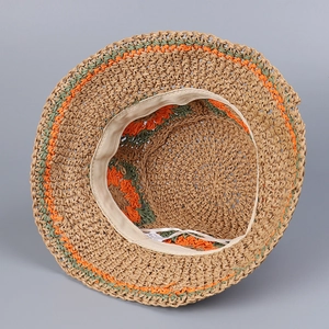 Detailed inside view of hand-woven straw hat showing fine stitching and inner sweatband