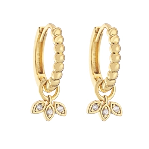 Detailed macro view of gold-plated hoop earrings with three sparkling leaf charms and gems