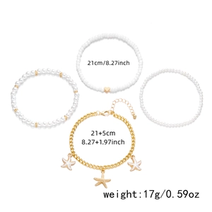 Bohemian starfish shell and pearl anklet set with dimension measurements on white backdrop
