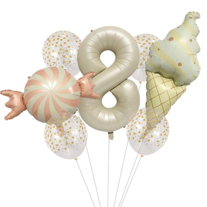 Detail of sweet dessert theme party set with number 8, candy, and ice cream balloons
