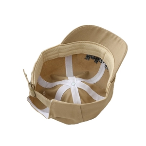 Interior detail of khaki baby baseball cap with cross reinforcement and cotton sweatband