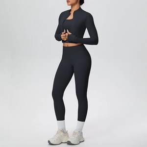 Three-piece black yoga set featuring zipper jacket with thumbholes and high waist leggings