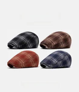 Detail of vintage plaid newsboy caps showing cotton textures and various color patterns