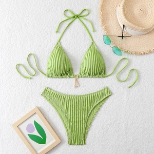 Detail of ribbed avocado green bikini top with starfish charm and sea pearl accent