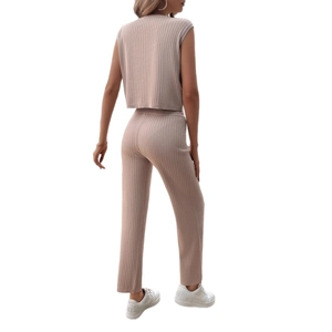 Women's beige ribbed knit two-piece set featuring a sleeveless top and wide-leg trousers