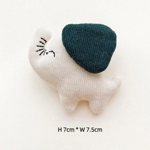 Handmade knitted elephant pendant in cream white and green, size 7cm x 7.5cm