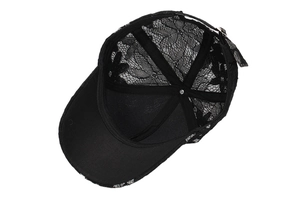 Internal view of black floral lace baseball cap with reinforced seams and metal buckle