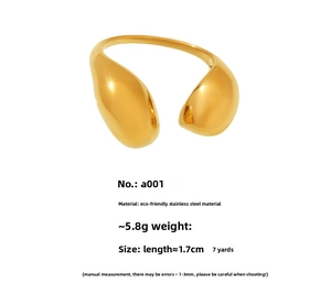 Macro detail of gold teardrop open ring made of polished stainless steel and size specs