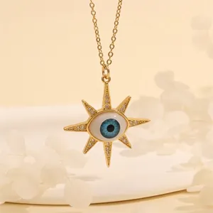Detailed close-up of 18K gold evil eye pendant with sunburst design and zircon accents