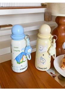 Detail of cartoon camping theme thermos flasks with cute puppy prints and floral charms