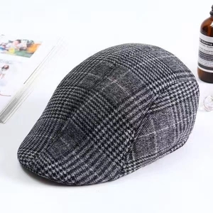 Detailed view of breathable plaid flat cap with grey and white Prince of Wales pattern
