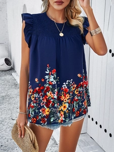Detailed view of the dark blue sleeveless floral top with smocked bodice design for women